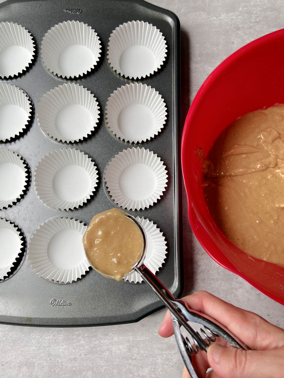 cupcake batter in muffin tin. 