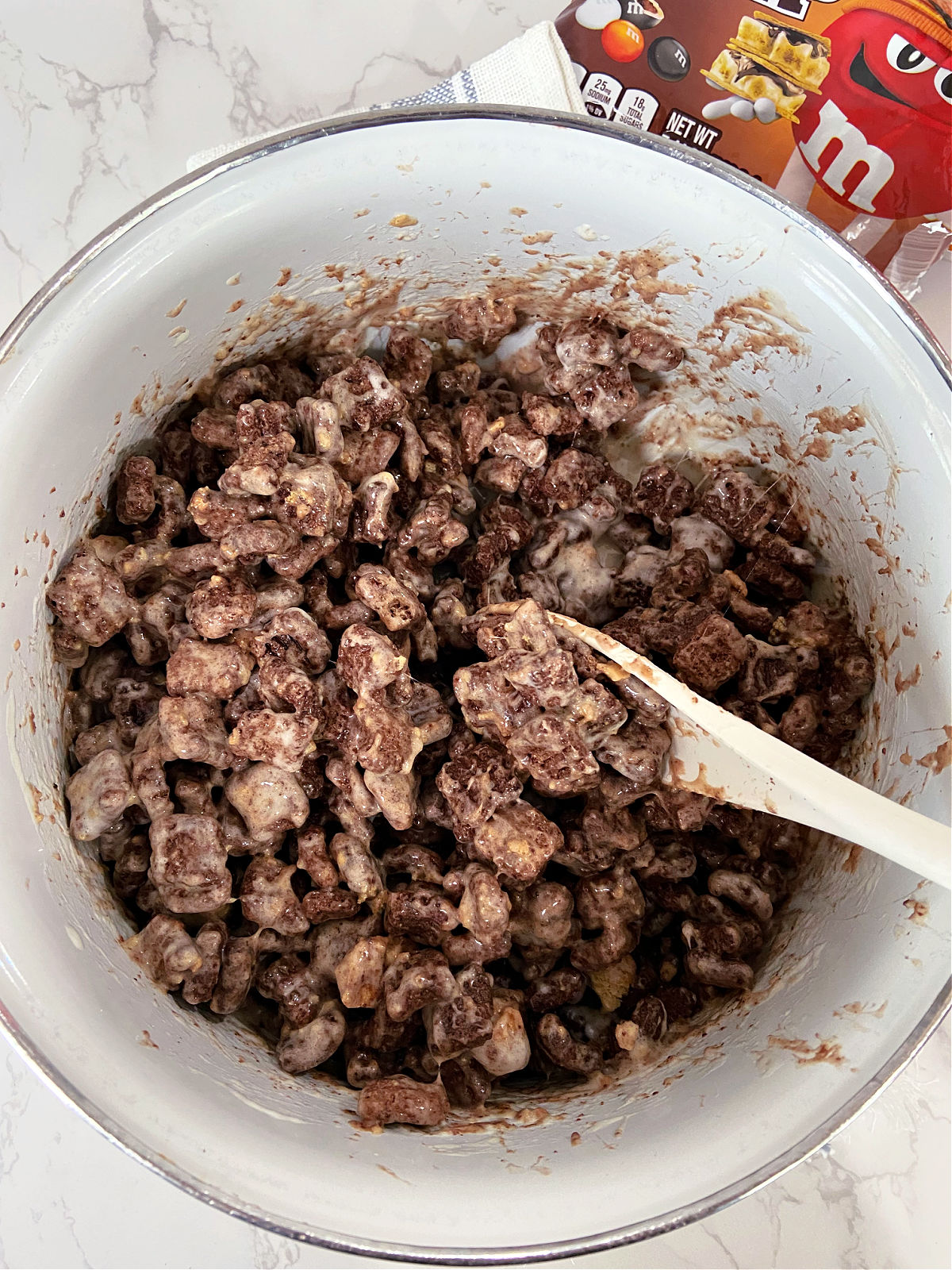 kit kat cereal and marshmallows in a large bowl. 