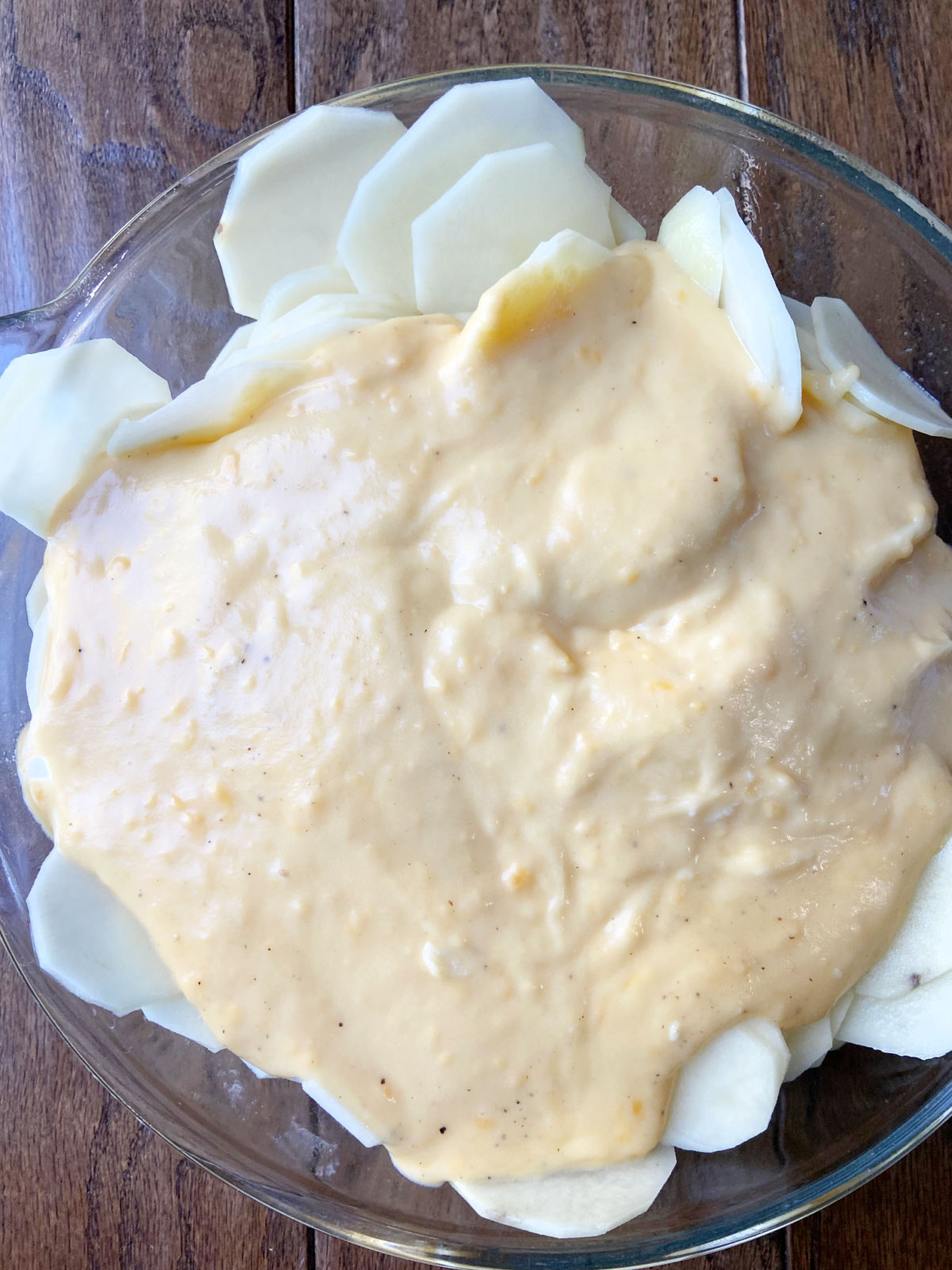 cheese sauce over potatoes. 