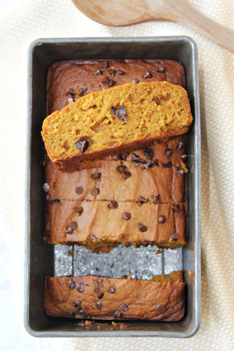 pumpkin bread resting on a loaf of bread. 