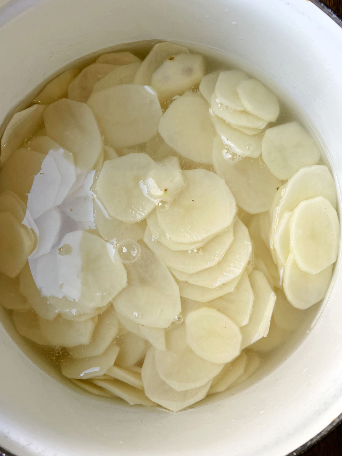 sliced potatoes in water.