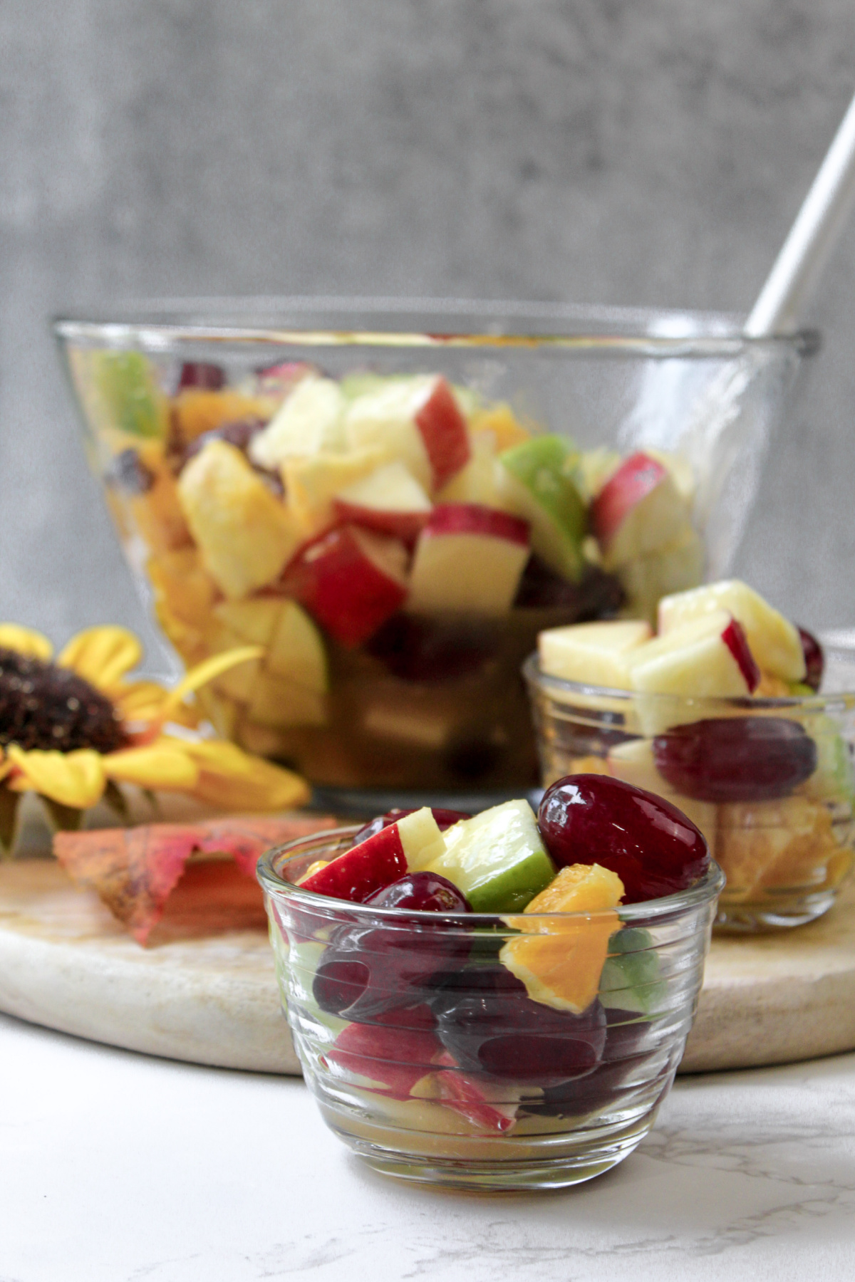 Fall fruit salad in a clear bowl. 