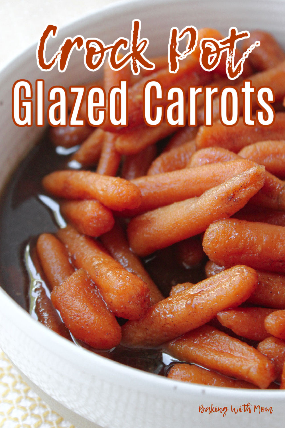 Crock pot glazed carrots in a white bowl in a brown sugar sauce. 