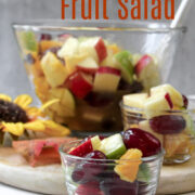 fall fruit salad in a clear bowl with a spoon.