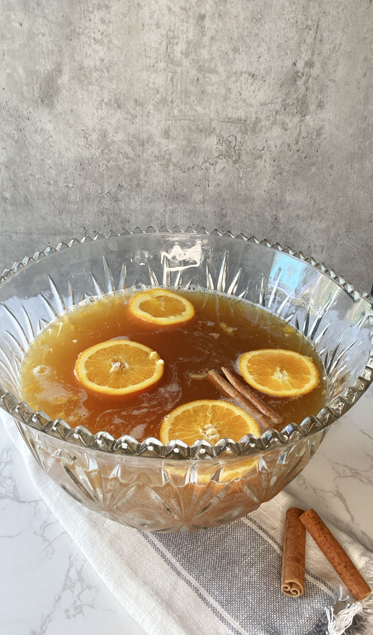 oranges floating in a punch bowl. 