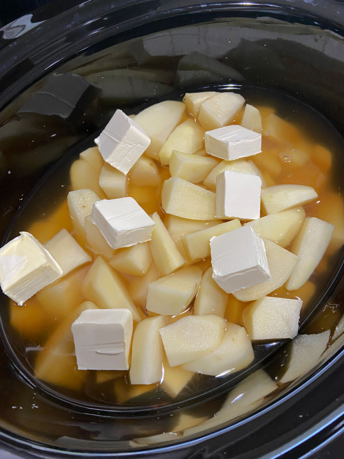 uncooked potatoes with butter. 