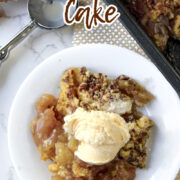 apple dump cake on a white plate.