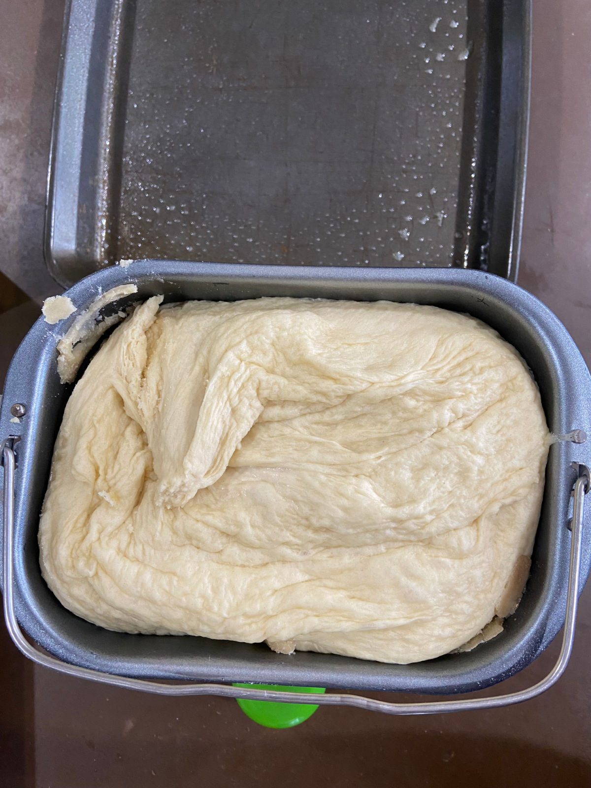 Dough in a bread machine pan. 
