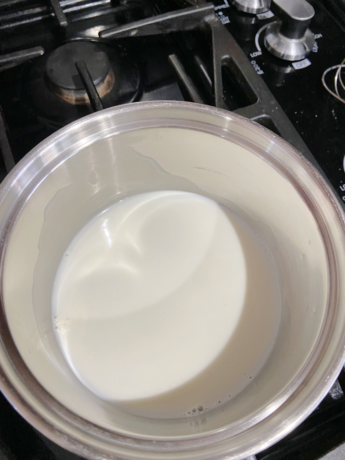 milk on the stove in a pan. 