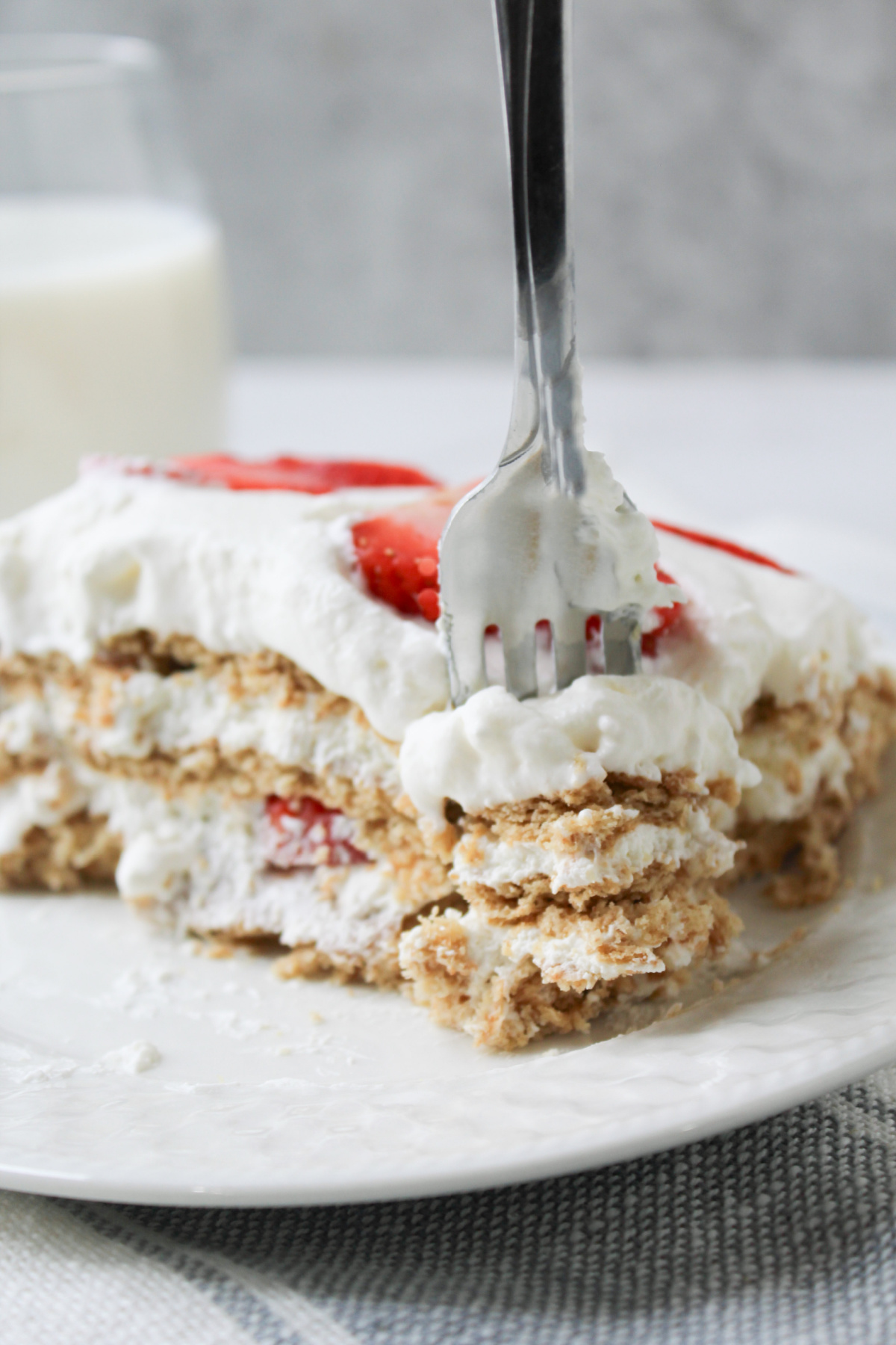 Strawberry Icebox Cake with a fork and plate.