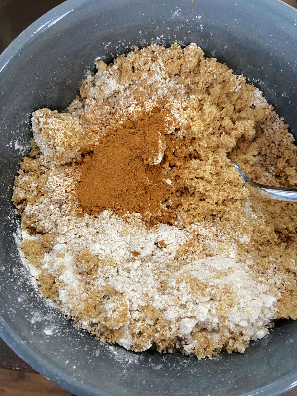 brown sugar, cinnamon and flour in a blue bowl. 