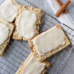 Brown Sugar Pop Tarts with frosting on a cooling rack.