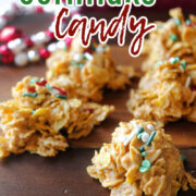 cornflakes candy on a brown tray with red and white behind.