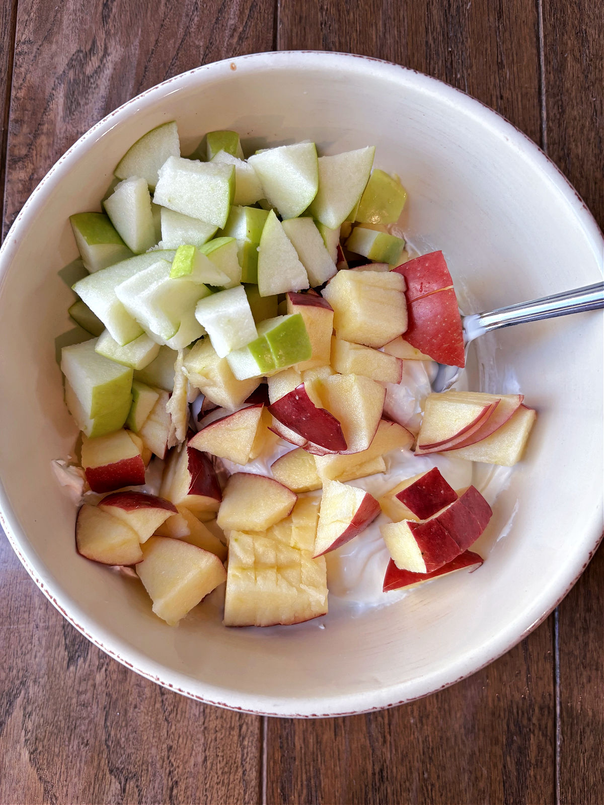 green and red apples in a bowl. 