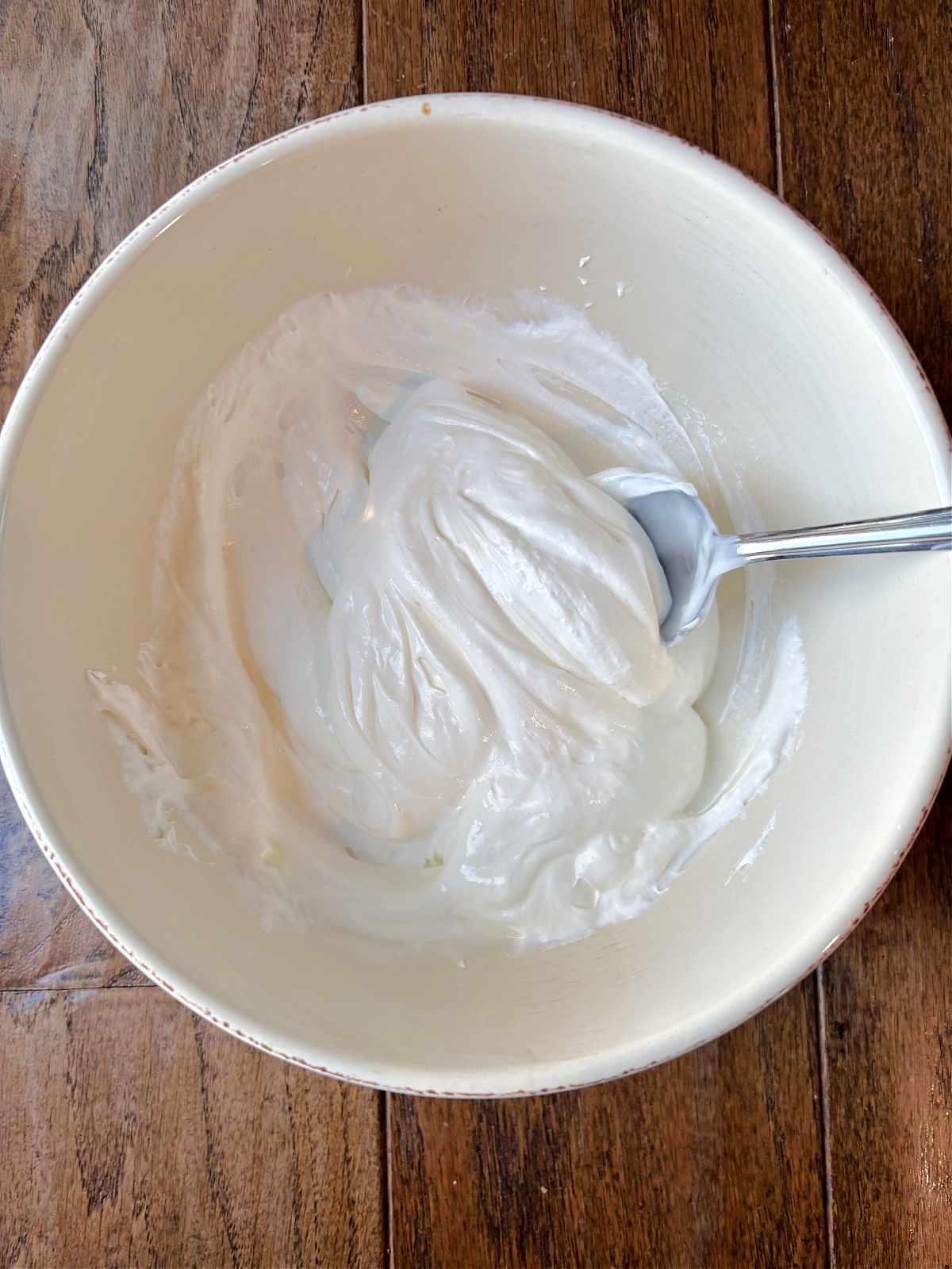 yogurt and whipped cream in a bowl. 