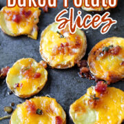 Baked potato slices on a baking sheet with cheese.