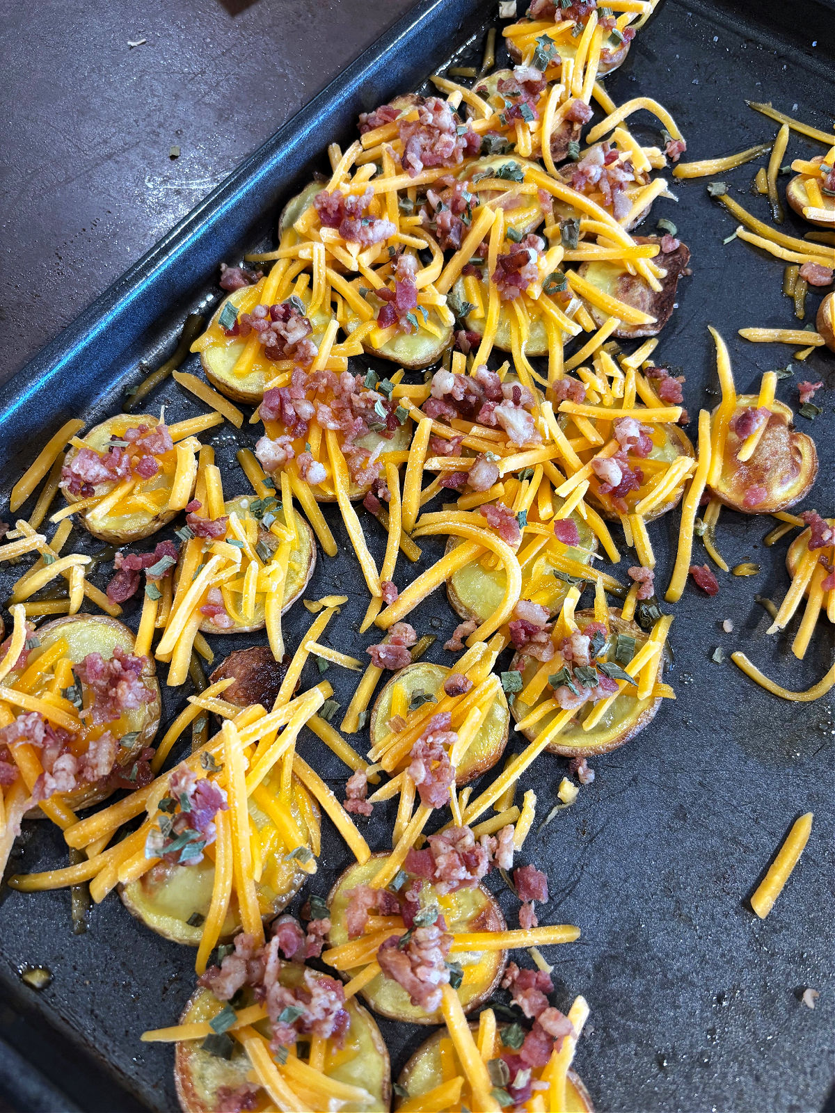 cheese and bacon on potato slices. 