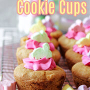 Easter Cookie Cups on a cooling rack with bunny marshmallows and frosting on top.
