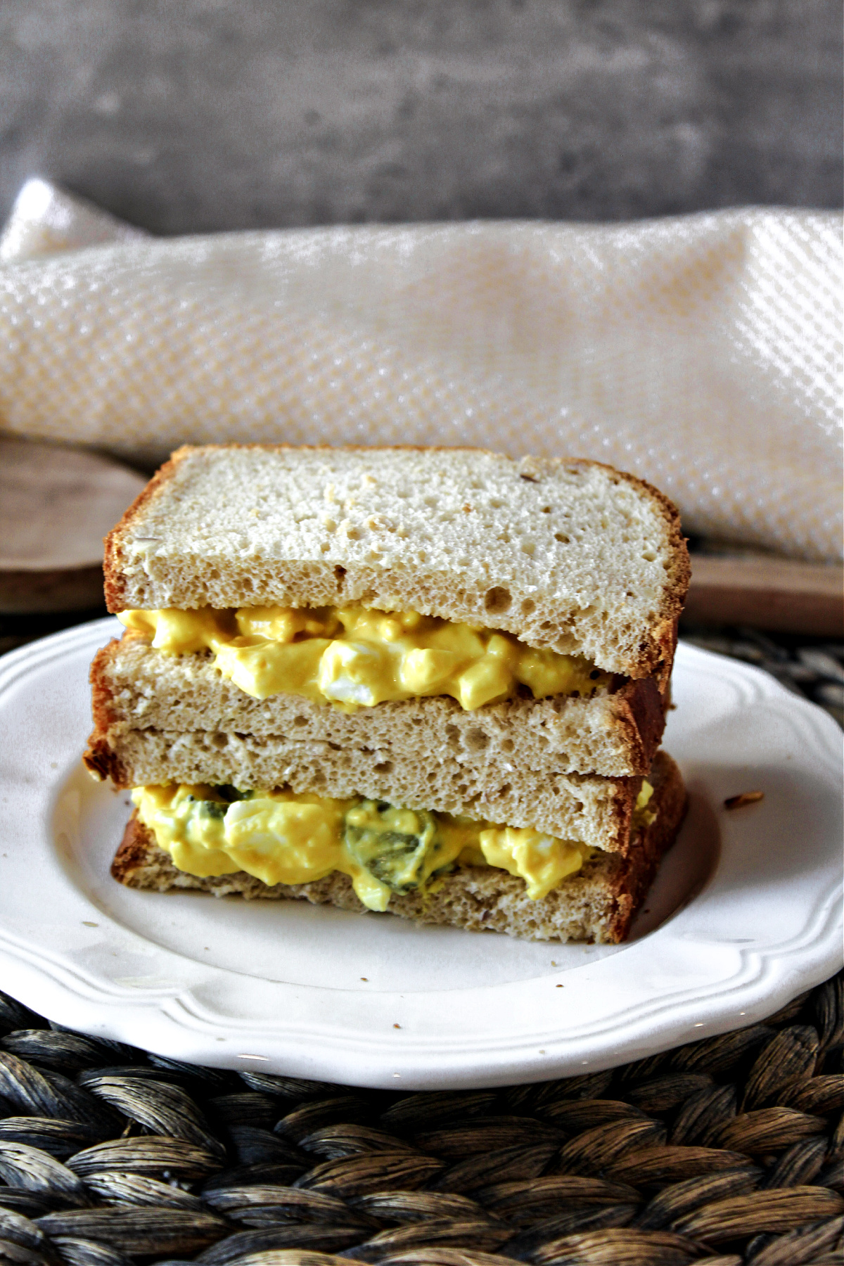 egg salad on a plate with bread. 
