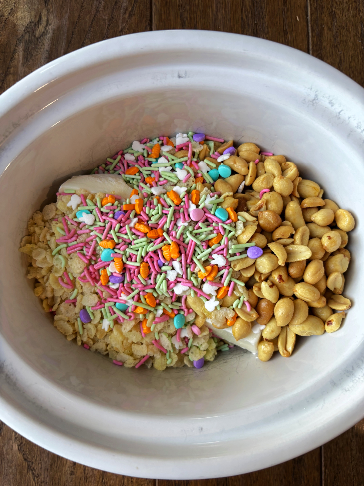 peanuts, sprinkles in a crock pot. 