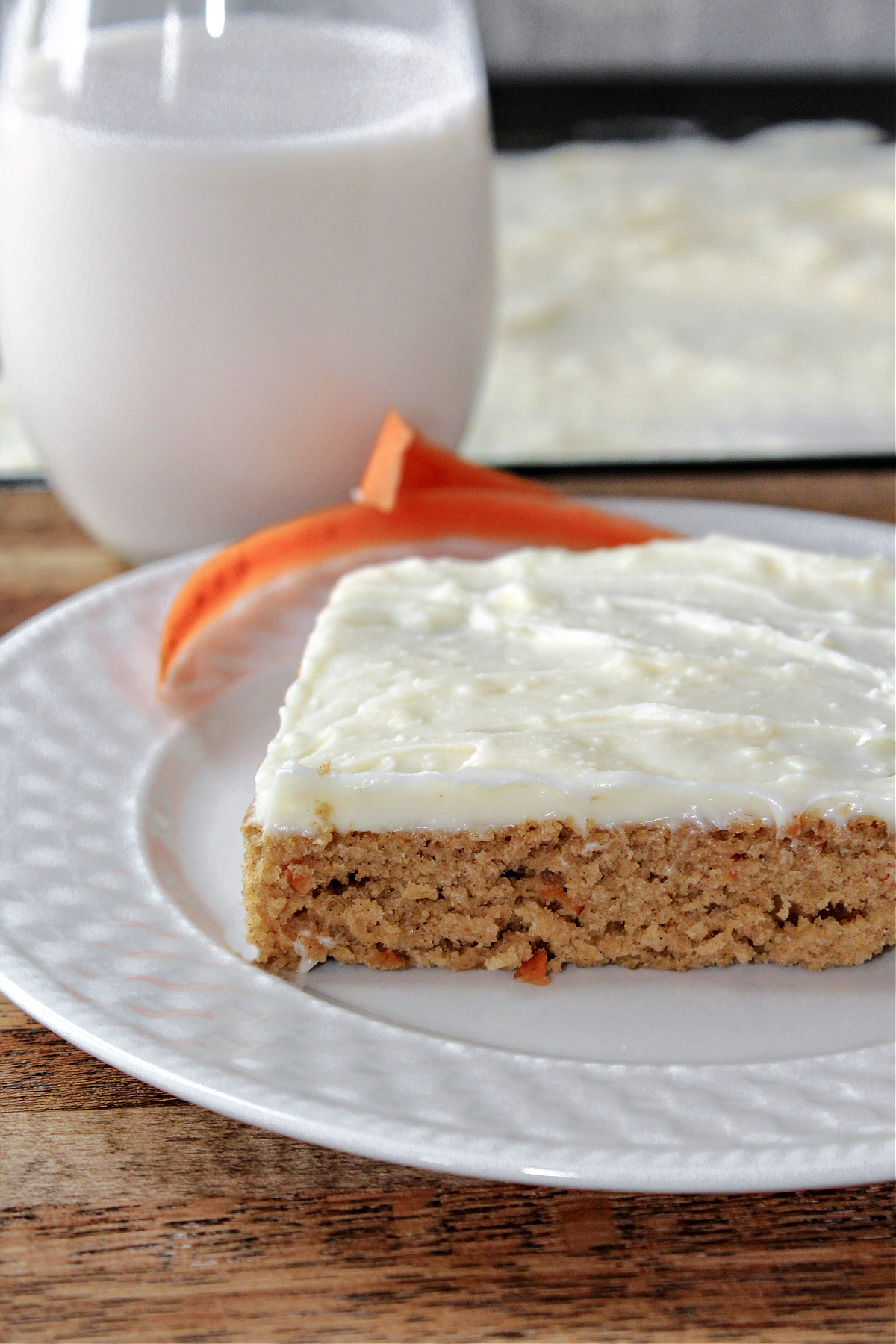 carrot cake bars on a white plate.
