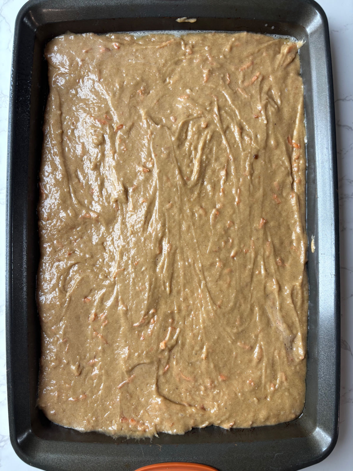 carrot cake batter in a pan. 