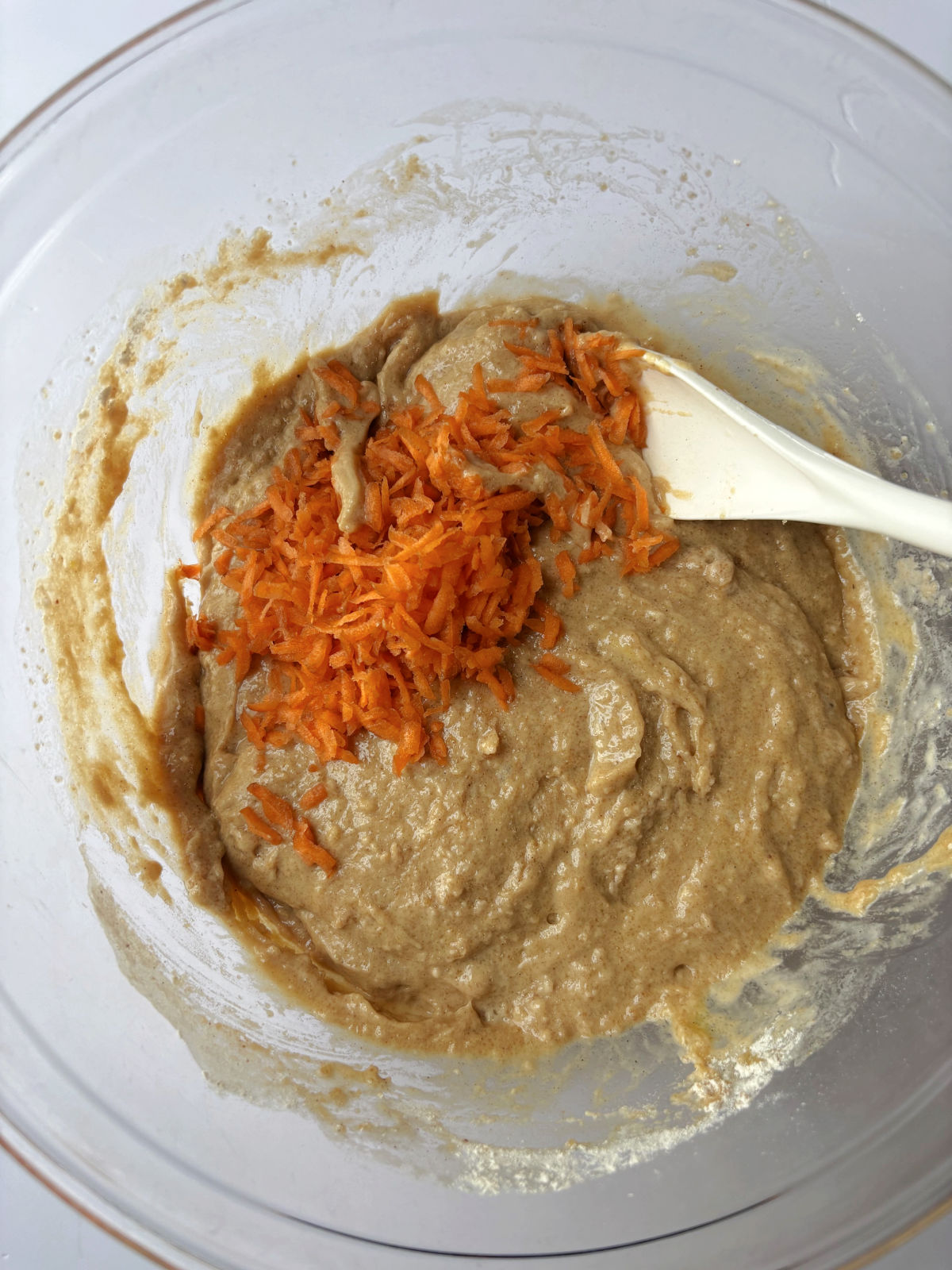 carrots in a wet batter in a bowl. 