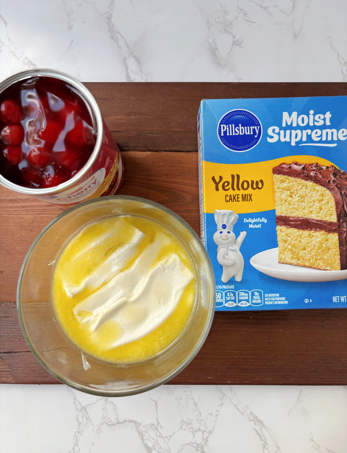 yellow cake mix, butter and can of cherries.