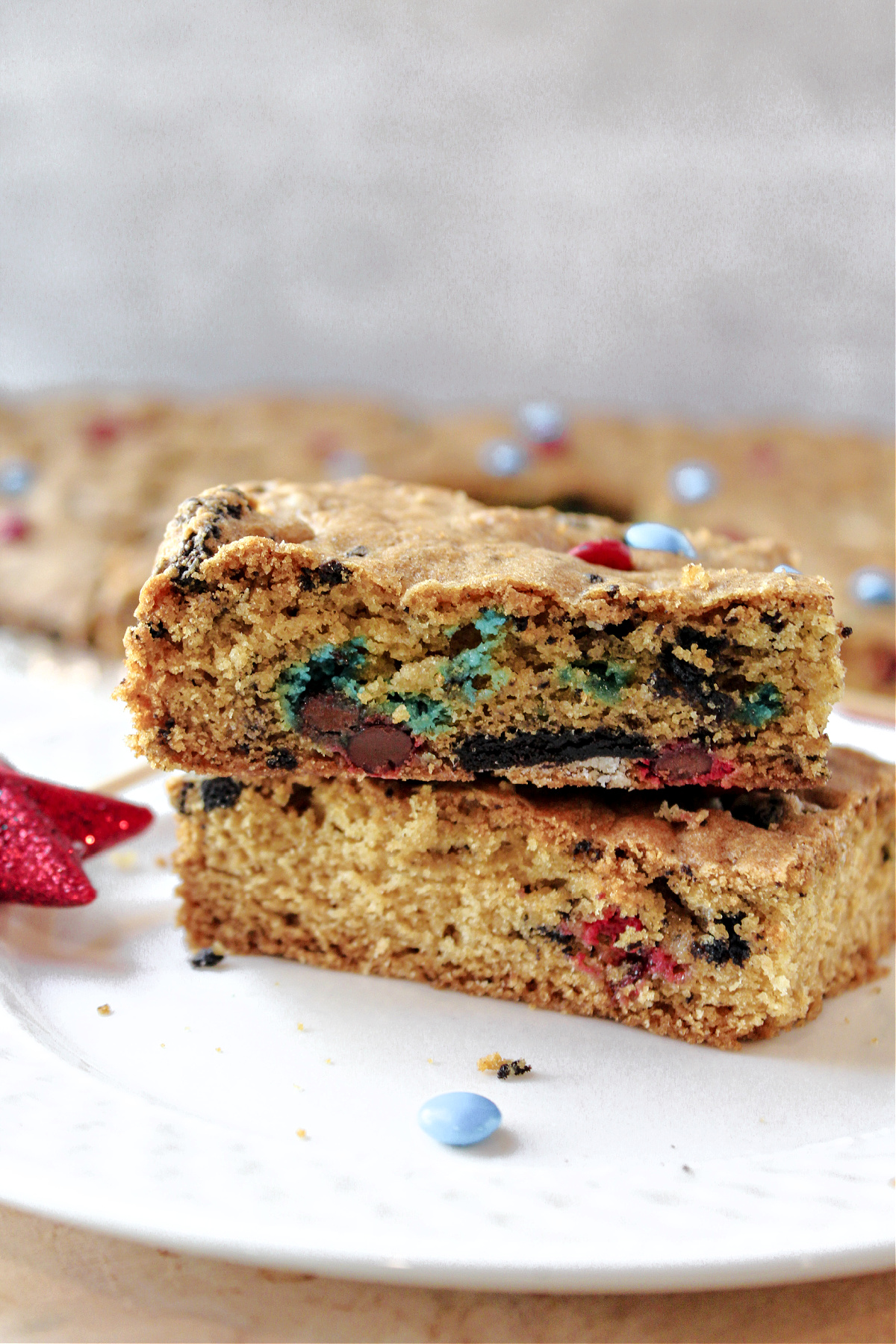 two cookie bars stacked on a plate.