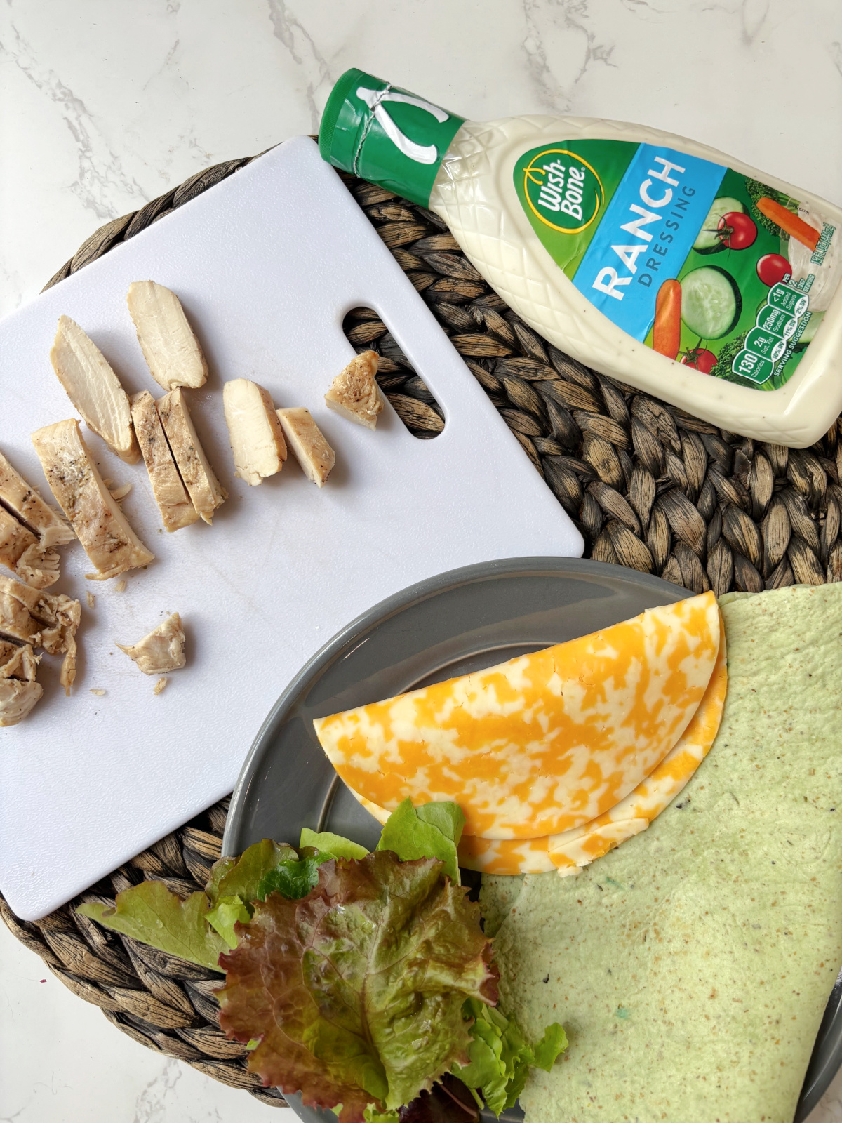 cheese, ranch dressing, chicken, lettuce.