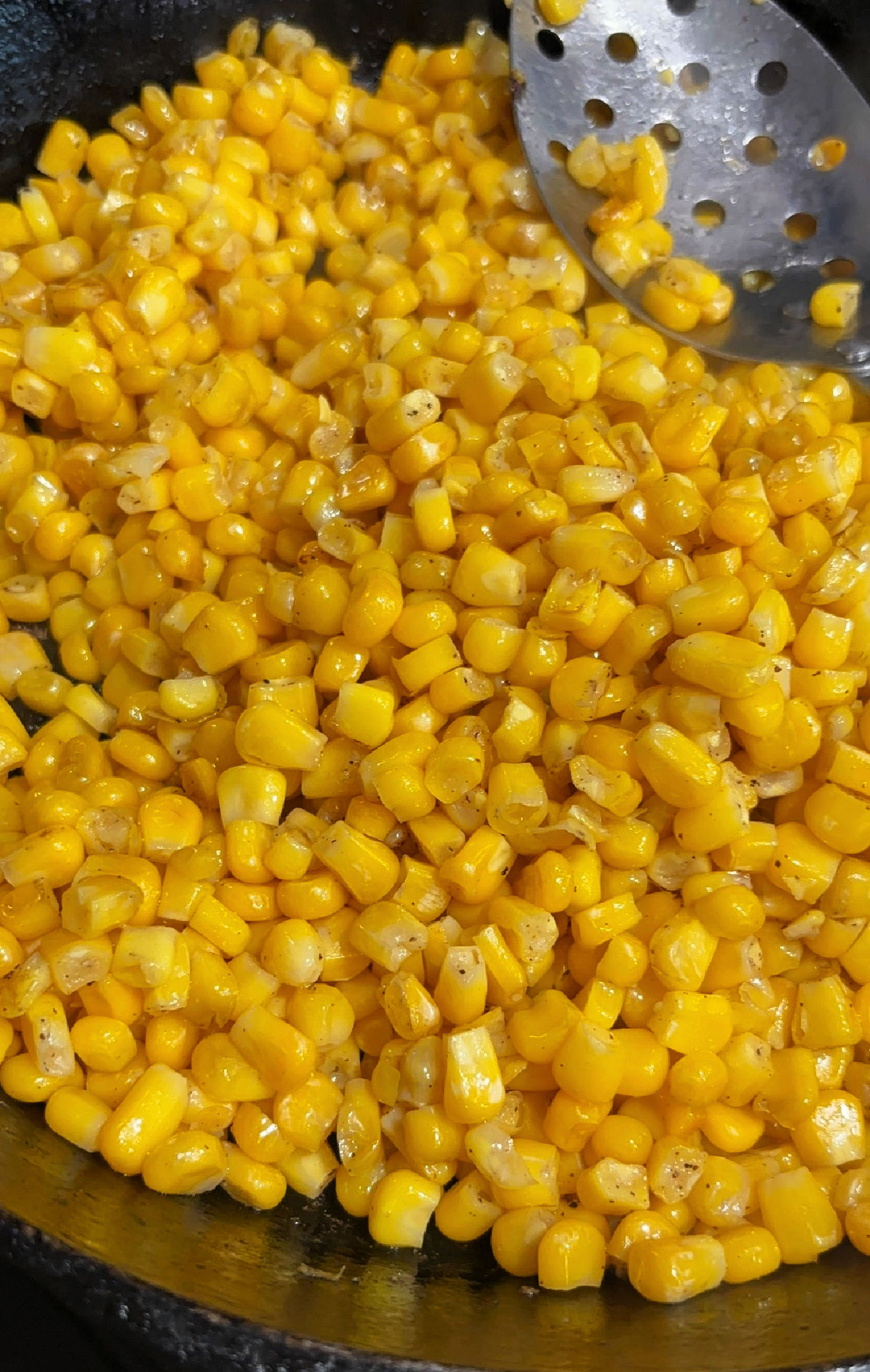 fried corn in a frying pan.
