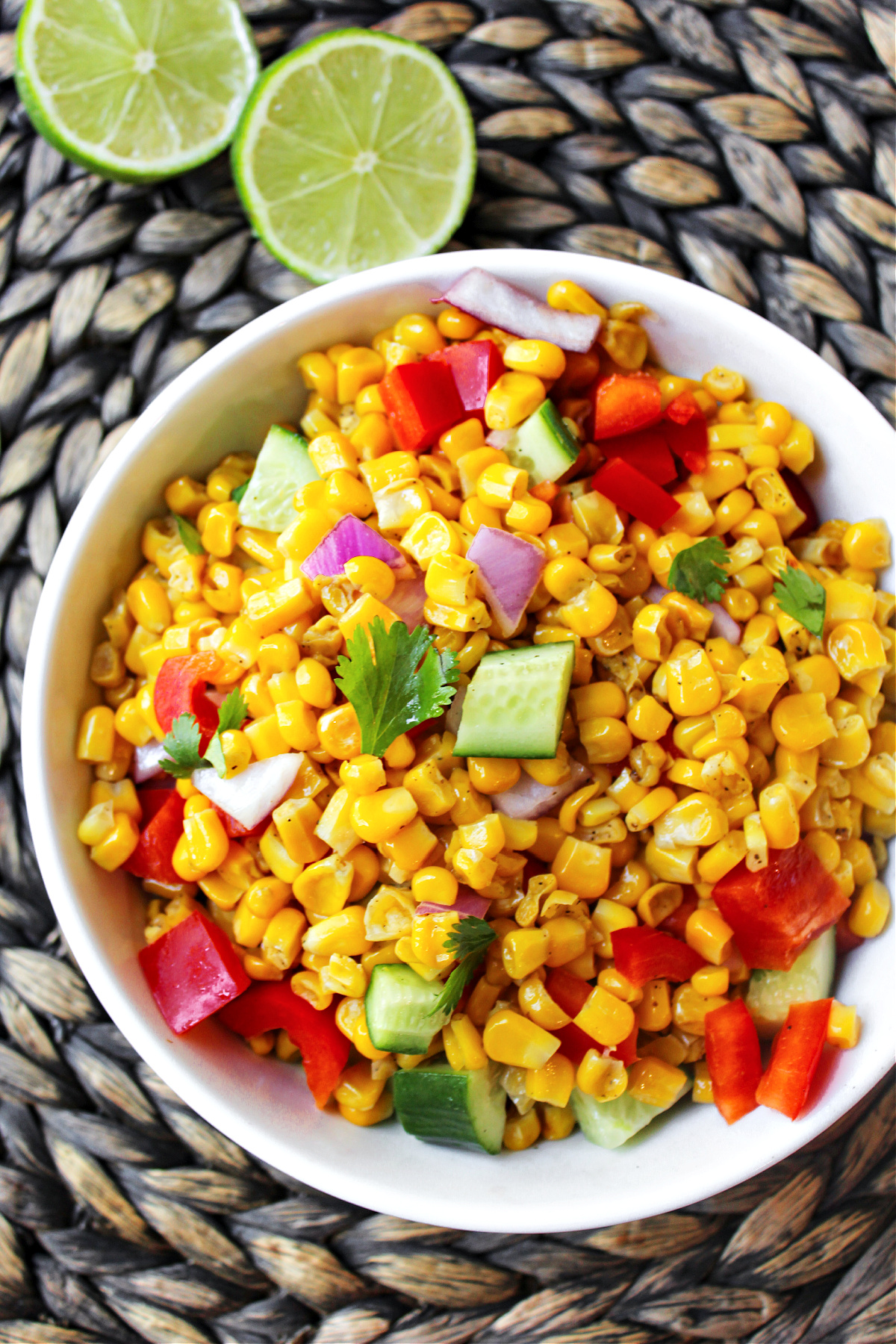 corn in a bowl with peppers.