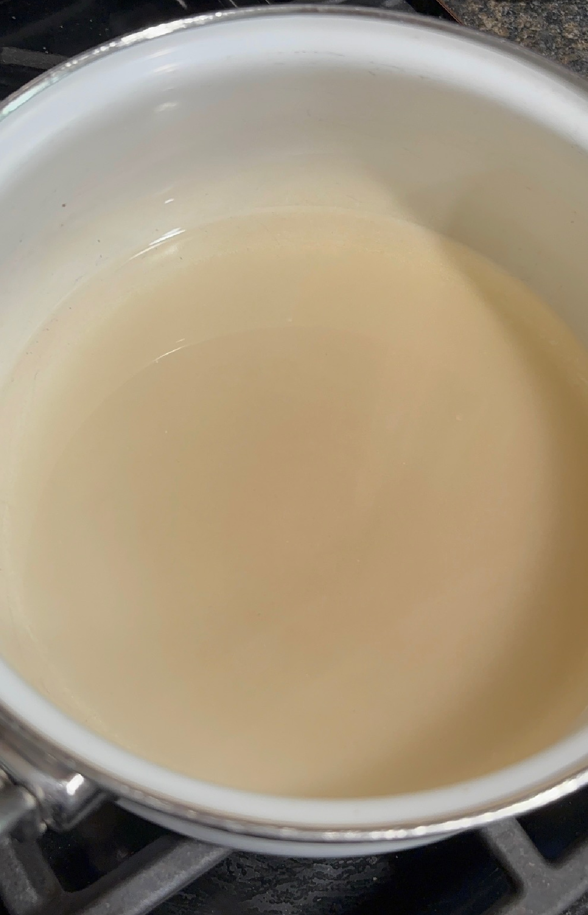 water and sugar with lemon juice in a pan.