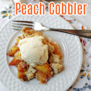 peach cobbler on a white plate.