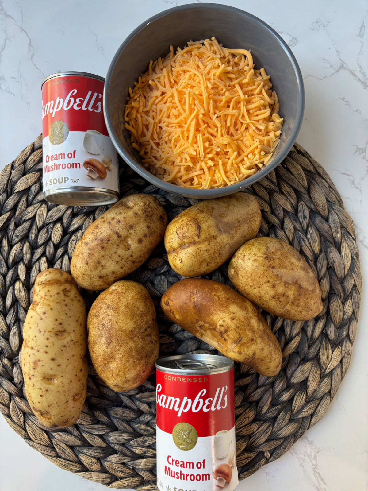 potatoes on a mat with cheese.