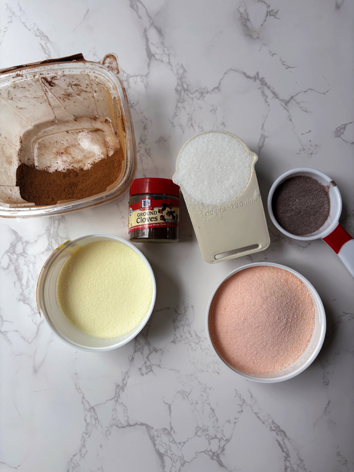 tea ingredients of tea, cinnamon, sugar, Tang and lemonade.