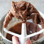 chocolate frosting on a paddle.