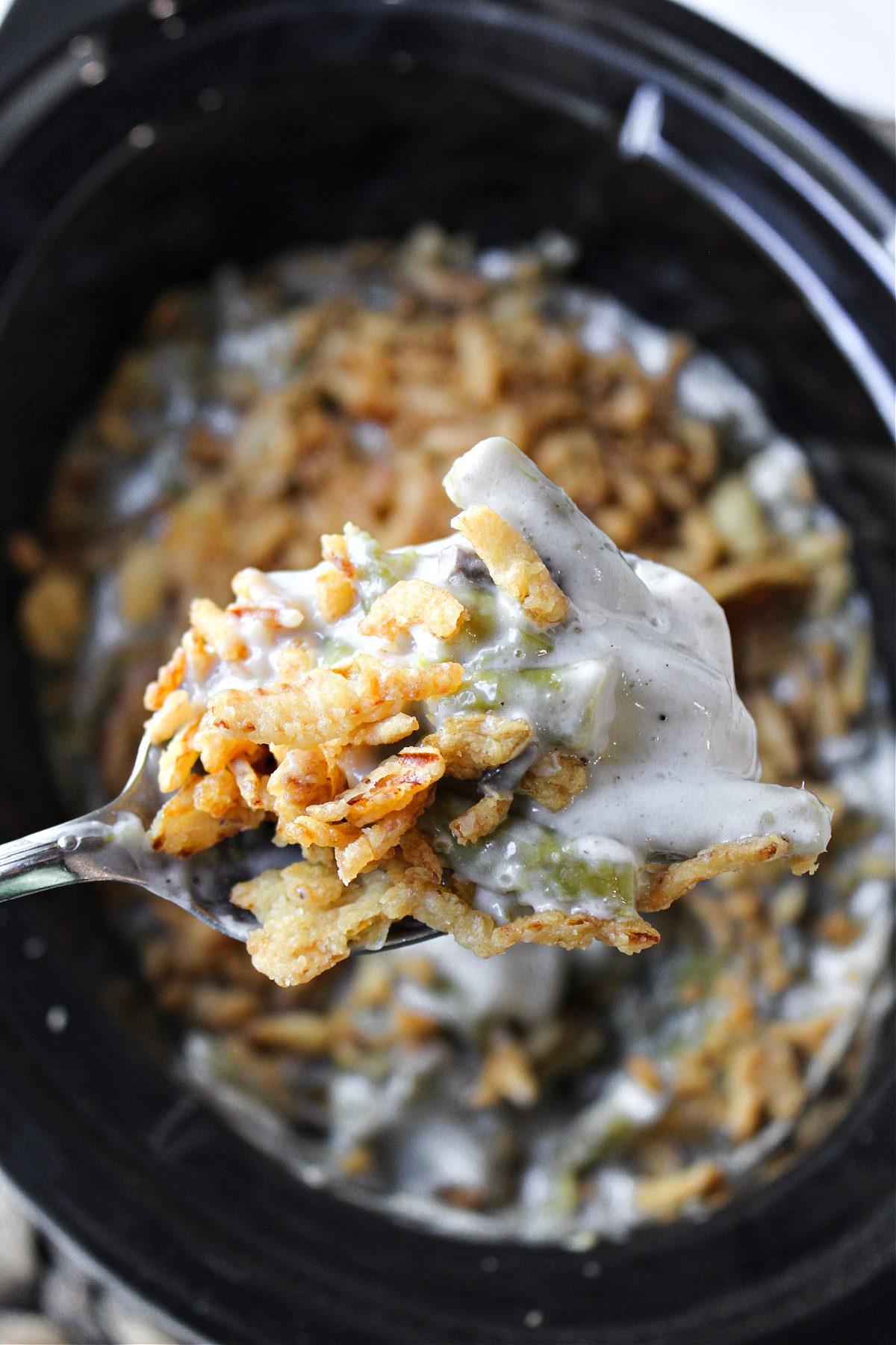 green bean casserole on a spoon. 
