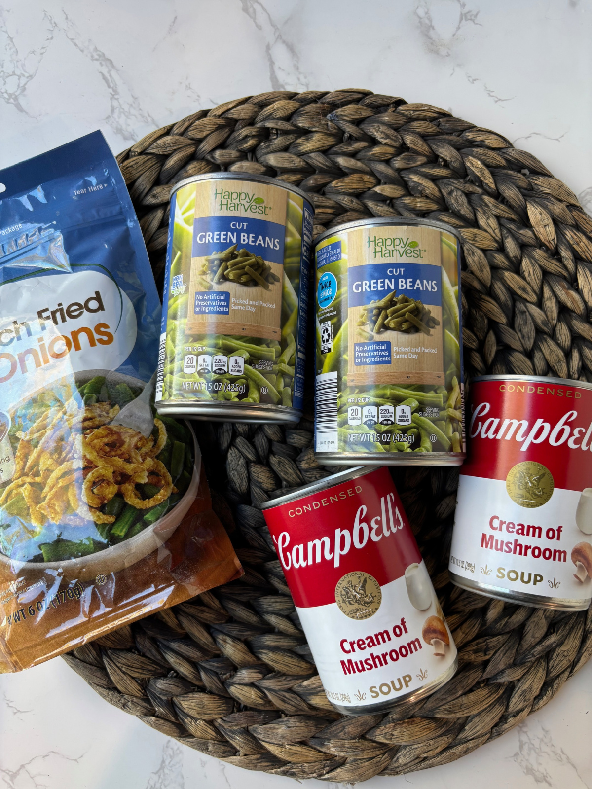 green bean casserole ingredients, fried onions, cream of mushroom soup and green beans. 