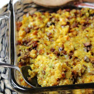 sausage stuffing casserole with a spoon.