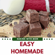 fudge on a brown board with a glass of milk behind.