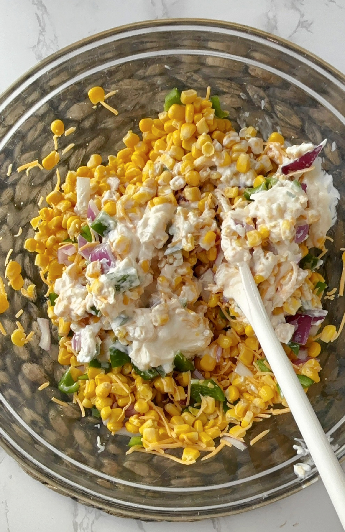 corn mix in a clear bowl.