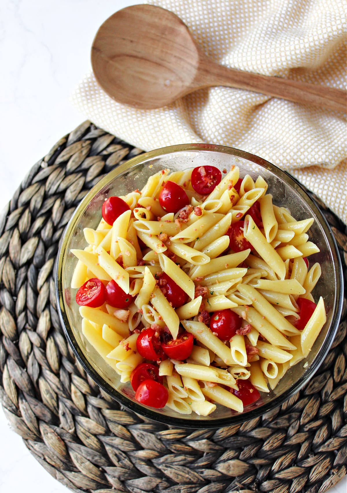 mostaccioli salad in a clear bowl. 