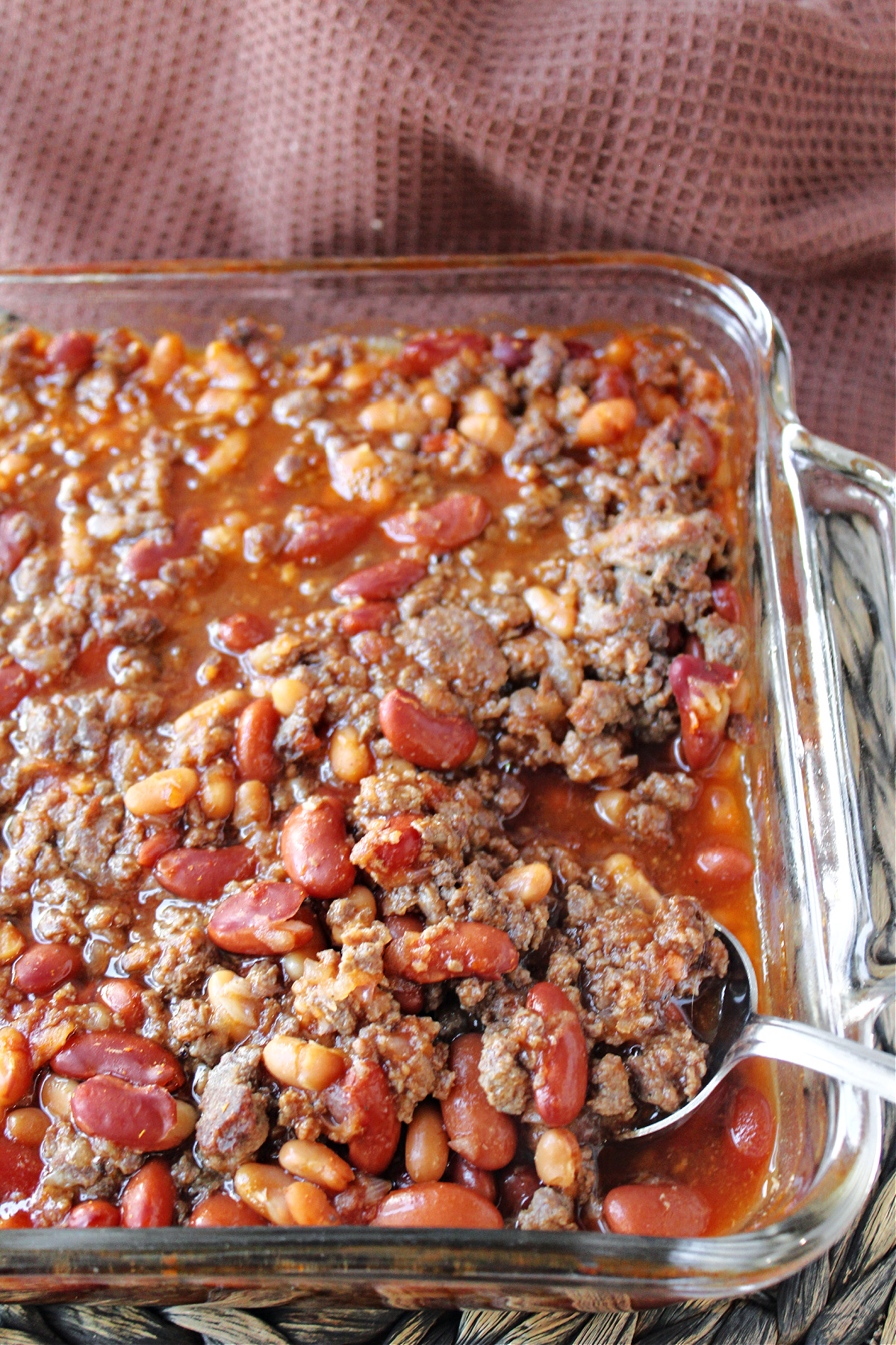 venison baked beans with a spoon.
