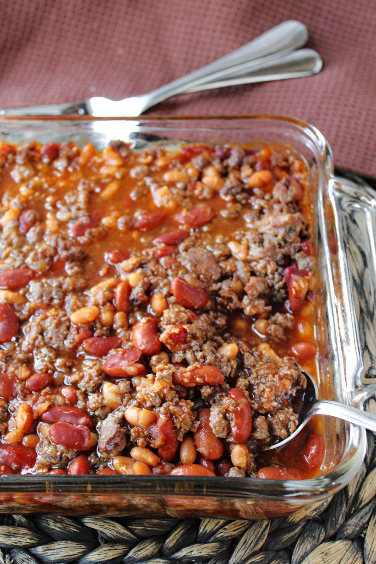 venison baked beans in a square baking dish. 
