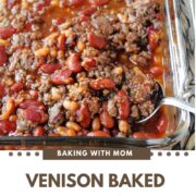 Venison Baked Beans in a baking dish with a spoon.
