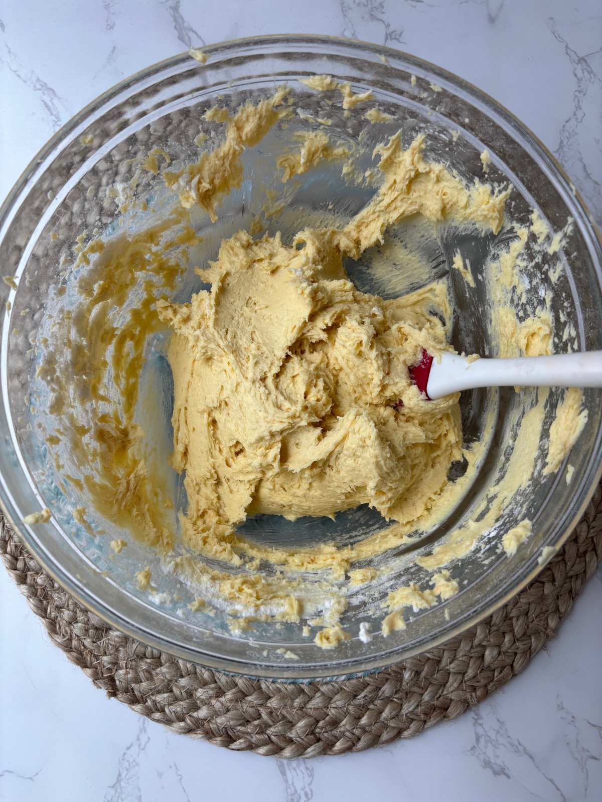 batter in a bowl with a spoon.