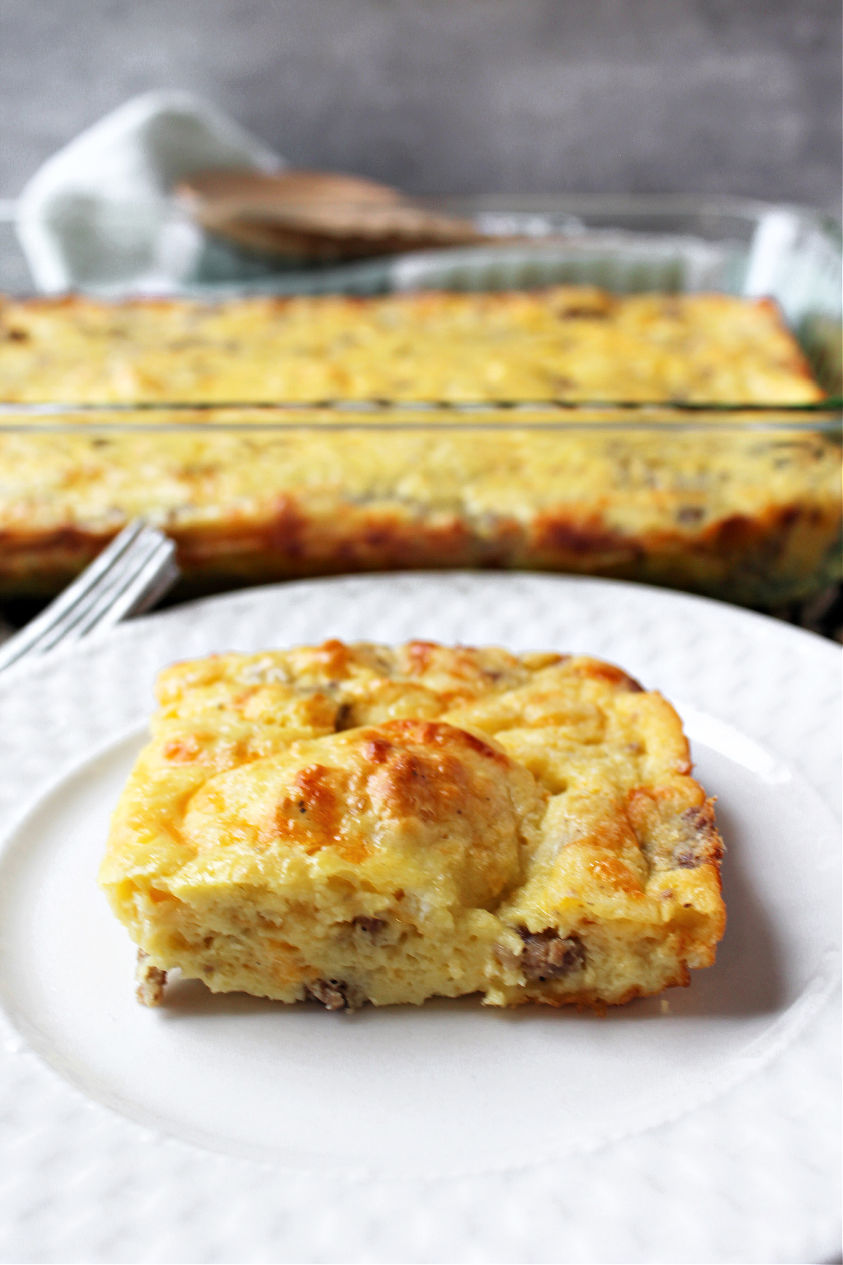 cheesy egg bake on a white plate. 