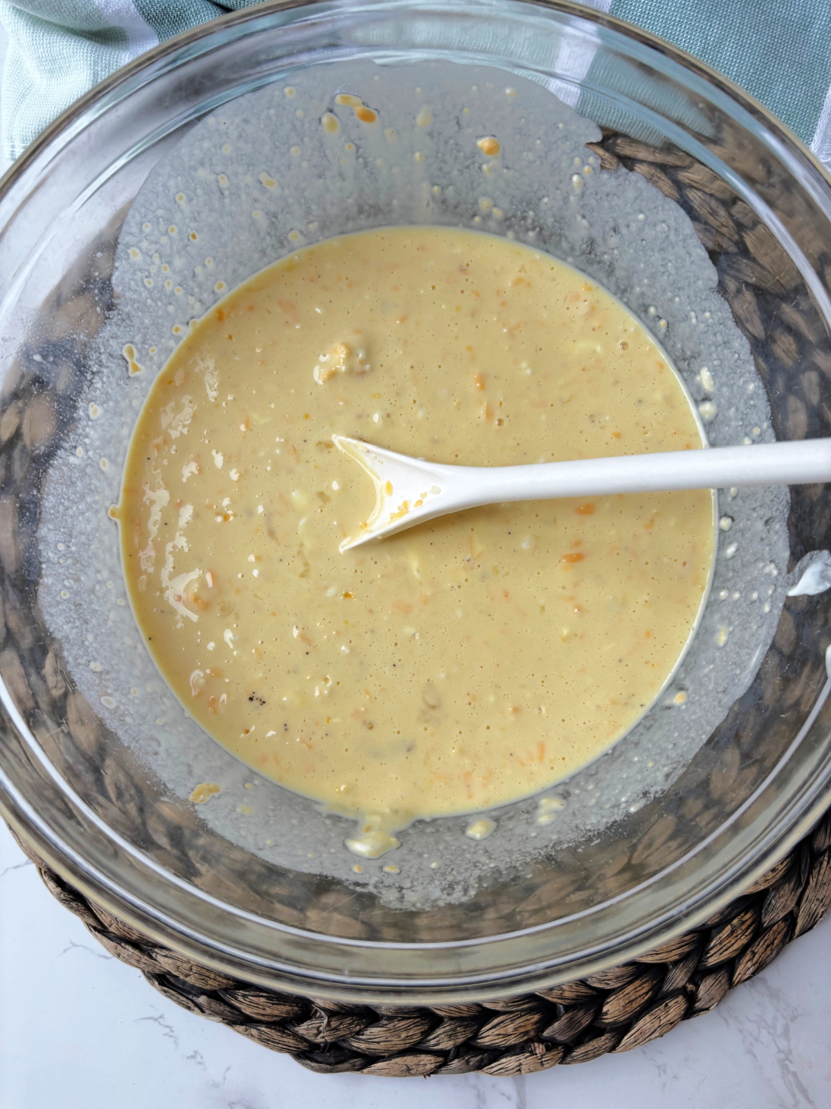 egg and biscuit batter in a clear bowl.