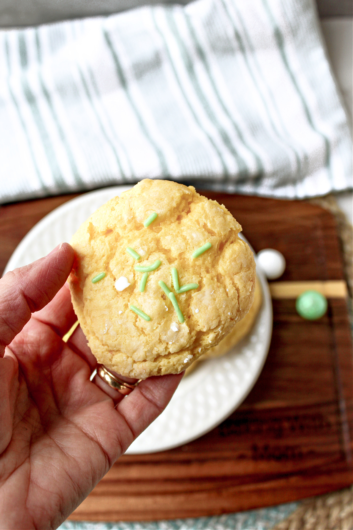 gooey butter st patrick cookie being held by a hand.